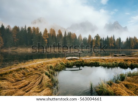 Great view of the foggy lake Antorno in National Park Tre Cime di Lavaredo. Location Auronzo, Misurina, Dolomiti alps, South Tyrol, Italy, Europe. Vintage style. Instagram toning effect. Beauty world.