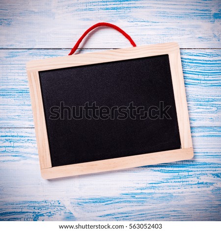 Frame on blue rustic wooden background, closeup
