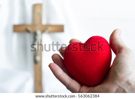 Giving heart to Jesus abstract concept with easter cross on a white background