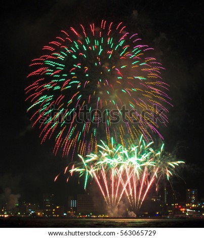 Spectacular fireworks light up the August sky in palm tree shapes in Shimonoseki, Japan. Large firework festivals are an important part of Japanese summer events.