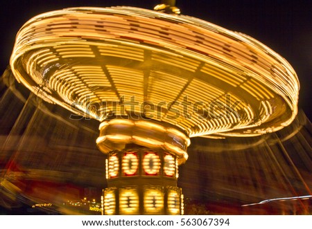 The swings on a high speed merry-go-round appear to reach light speed in the summer night sky at an amusement park in Japan in this time lapse photo.