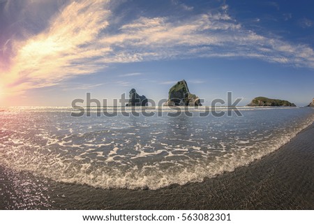Wharariki beach in South New Zealand at sunet scenery