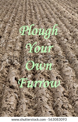 Ploughed Field Background with the inspirational message of Plough Your Own Furrow