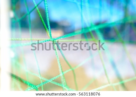 Double exposure of goal net merging together in criss cross patterns