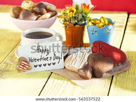 Happy Valentine's Day card. cookies with heart shape on wooden background,blank space