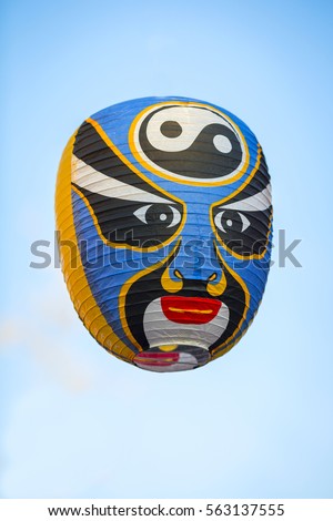 Chinese Mask on a Sky Blue background.