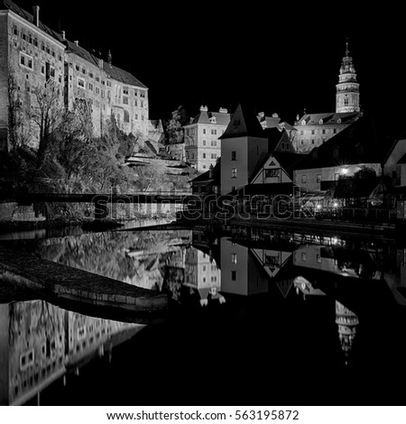 Night historical city in water reflection