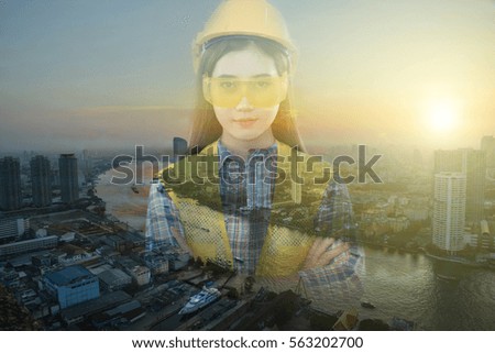 Engineer woman with twilight city scape.  