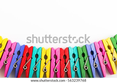 Group colorful clothespin on white background