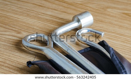 Closeup of Car maintenance repair tools on wooden table