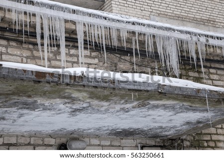 icicle on roof in city in winter, winter landscape macro