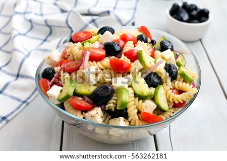 Greek Salad with Pasta Royalty-Free Stock Photo #563262181