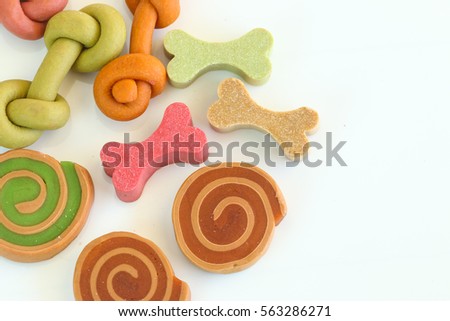 Delicious of dog biscuits , dog snack or dog  chew copy space on the white , Can use background , Advertising for pet food. Royalty-Free Stock Photo #563286271