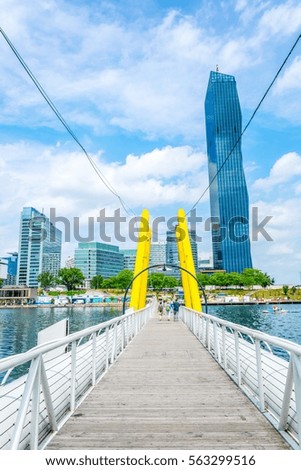View of a floating bridge over danube river near VIC and Donauturm in Vienna, Austria.