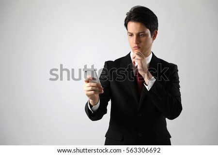 young businessman looking a smart phone