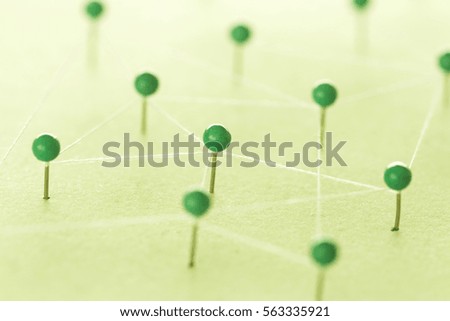 Grren pins on green background creating a network. Connect concept