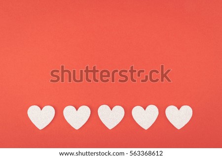 background of glitter white heart line on red paper