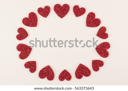 round glitter red heart frame on white paper background