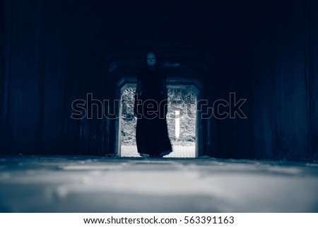 Walkway in tunnel with scary woman inside, darkness horror and halloween background concept

