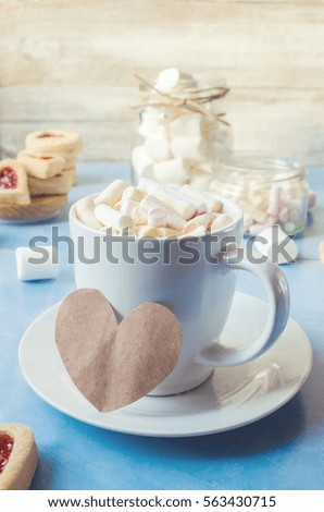 cocoa with marshmallows and a cookie heart. Selective focus.  