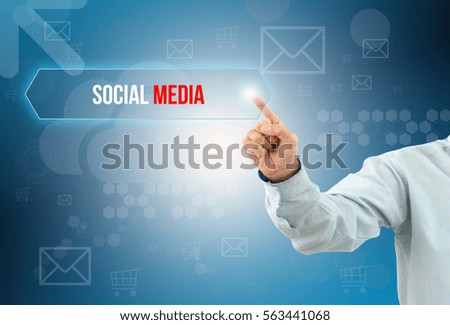 business man touch a button on an imaginary screen with text SOCIAL MEDIA