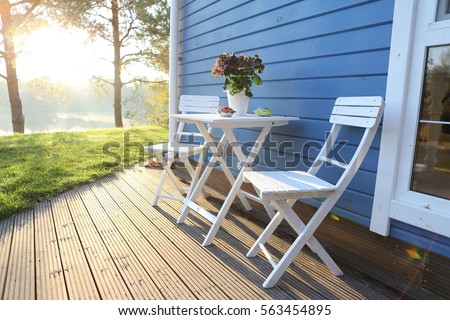 summer terrace, table and chairs Royalty-Free Stock Photo #563454895