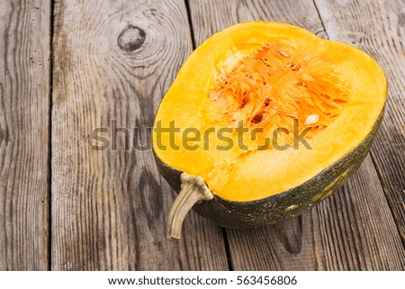 Half a butternut squash on the wooden background. Studio Photo