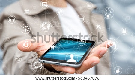 Businessman holding multimedia network over mobile phone 3D rendering