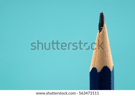 Pencil on a blue background. Back to school. Copy space.