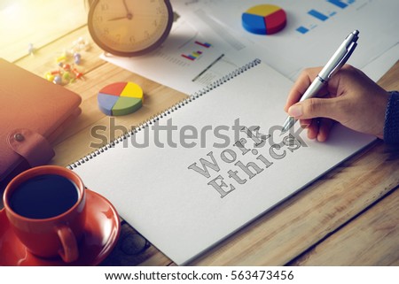 Man hand writing word work ethics
 Royalty-Free Stock Photo #563473456