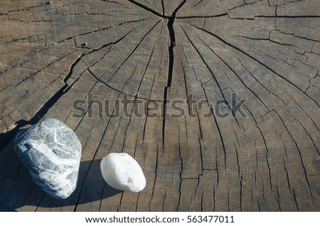 Spa beautiful and unusual decorative pebbles on the old cracked wooden background