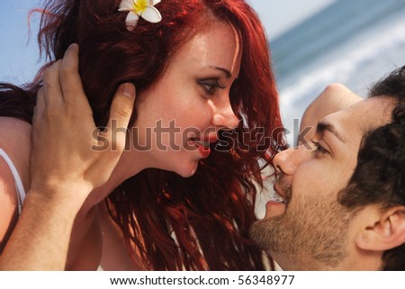 Young Couple at the beach holding each other