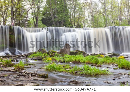 Keila Joa waterfall, long exposure and spring time with greenery.