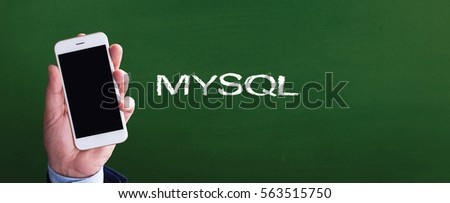 Smart phone in hand front of blackboard and written MYSQL