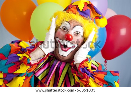 Birthday clown in full costume, looking surprised. Royalty-Free Stock Photo #56351833