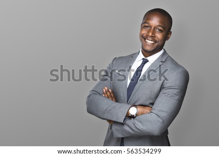 Attractive handsome happy smiling professional businessman executive with a stylish suit and tie Royalty-Free Stock Photo #563534299