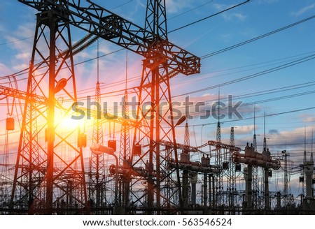  high-voltage  power lines at sunset. electricity distribution station . high voltage electric transmission tower.  Royalty-Free Stock Photo #563546524