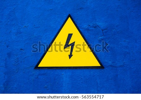  Sign "Attention! High Voltage" on the wall. Also can be used as background.
