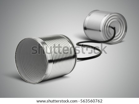 Tin can telephone with cord on grey, telephony concept Royalty-Free Stock Photo #563560762