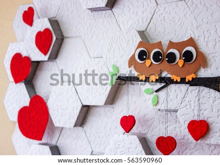 Decoration on the wall Valentine's Day. Red hearts. Royalty-Free Stock Photo #563590960