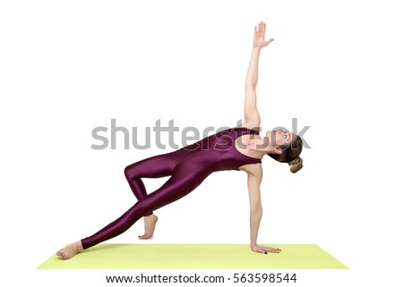 View at young woman practicing yoga in the studio
