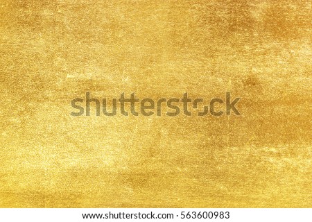 Shiny yellow leaf gold foil texture background Royalty-Free Stock Photo #563600983