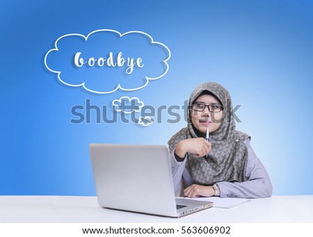 Goodbye word and Potrait of young muslimah businesswomen with laptop