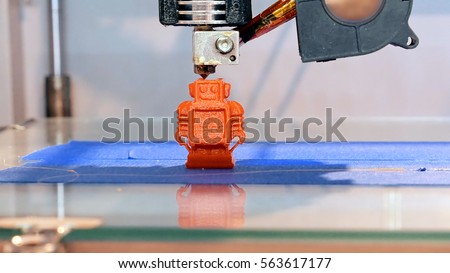 Automatic three dimensional 3d printer performs product creation. Modern 3D printing or additive manufacturing and robotic automation technology. Royalty-Free Stock Photo #563617177