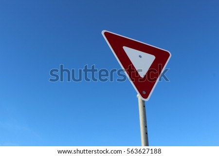 Yield Sign Against Blue Sky