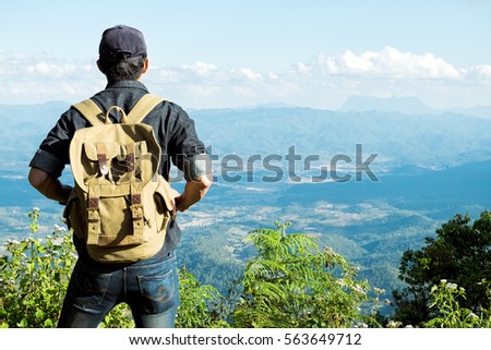 Man Traveler with backpack hiking outdoor Travel Life style and Adventure concept.
