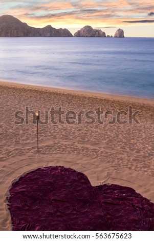 Heart in sand on tropical island at sunset for romantic marriage proposal - Cabo San Lucas Mexico
