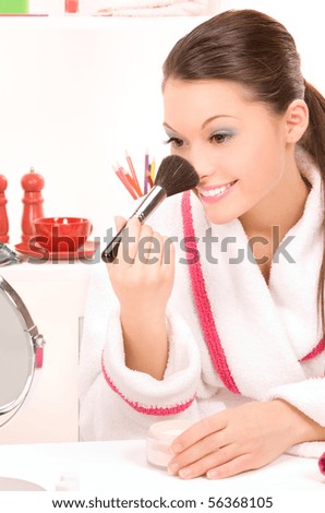 picture of  lovely woman with brush and mirror