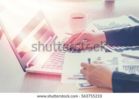 Close Up of woman hands using mobile phone and laptop computer with blank copy space screen for your advertising text message or content business in the Vintage effect.