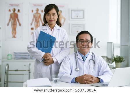 Asian doctor and nurse in medical office